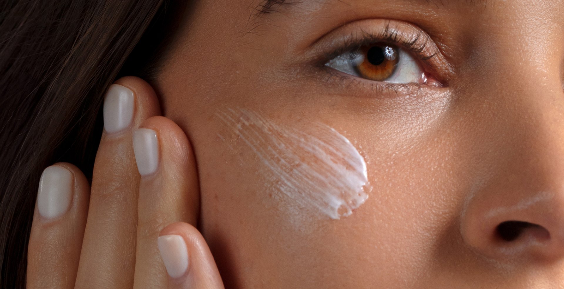 A lady applying face care product