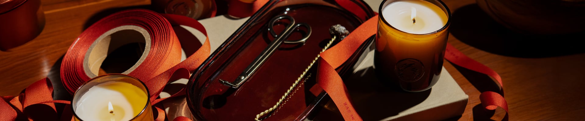 A candle, scissors, and some books