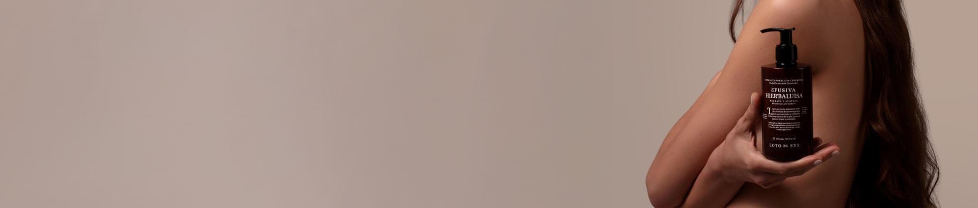 image of a lady holding a body cream