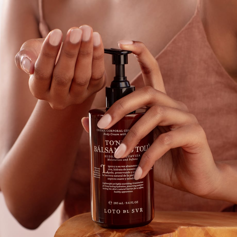 image of a body cream in a lady's hands