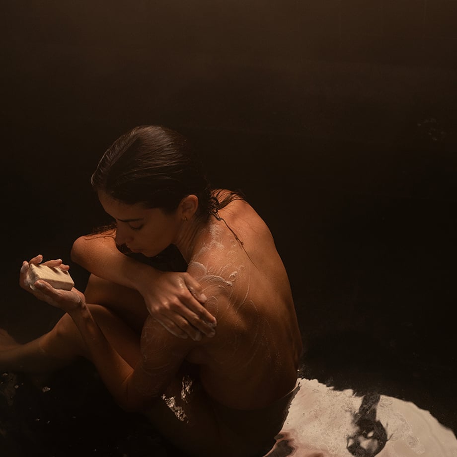 A lady holding a soap.jpg